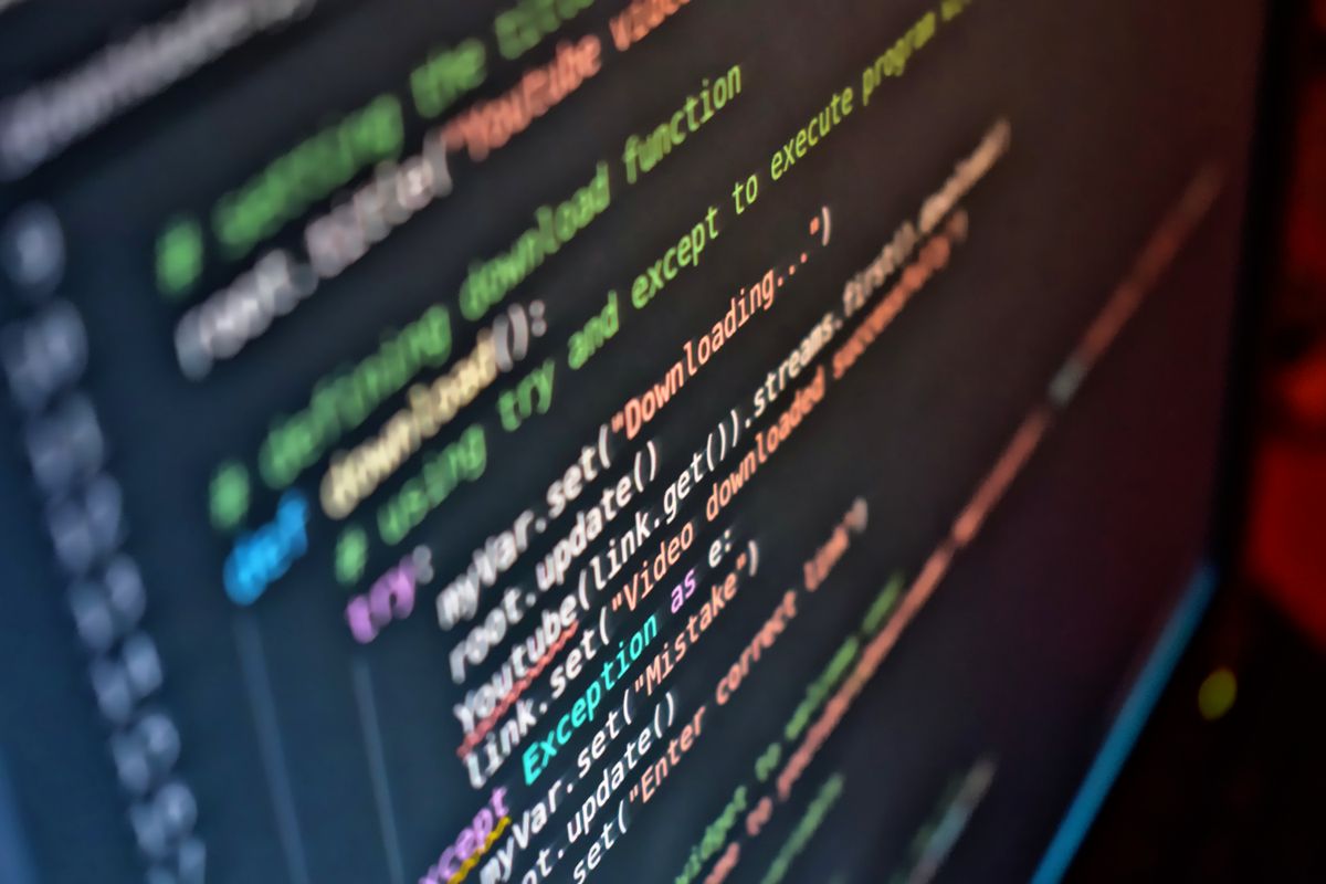 A developer reading code closely on a screen